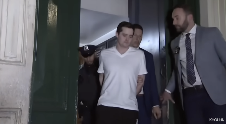 John Woeltz being perp walked after allegedly torturing Italian man